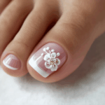 Elegant floral nail art with 3D white flower design on a natural pink and white French manicure at Golden Rose Nail Studio. Perfect for sophisticated and stylish nail beauty.